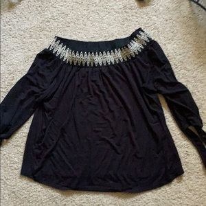 Black off the shoulder long sleeve shirt.